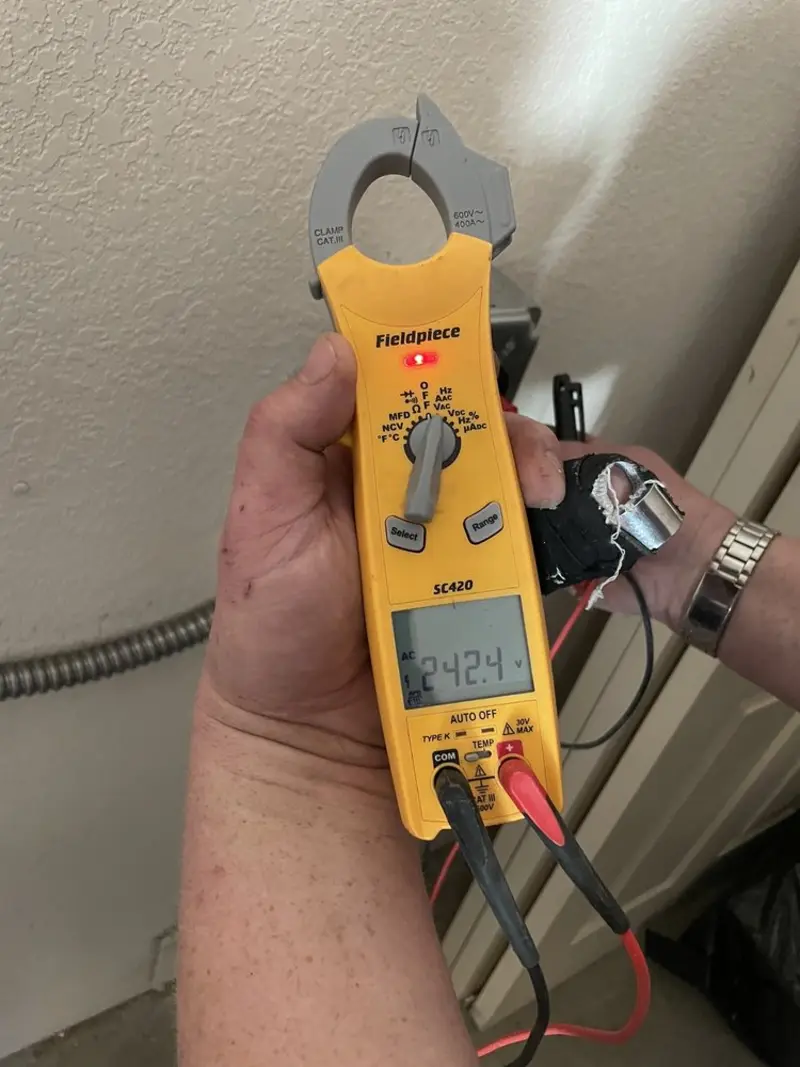 Voltage testing with clamp meter during Whole House Surge Protector in Eastlake